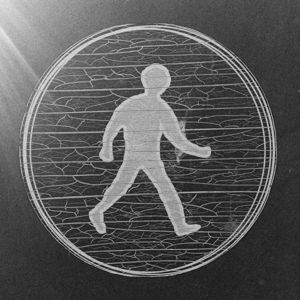 There is a large circular sticker, a walking pedestrian sign, crinkled and crackled by decay and age.